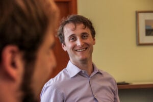 Scrum Trainer Anton smiles at workshop participant