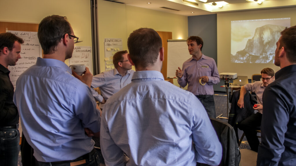 Scrum Trainer Anton explains something to the group